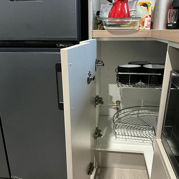 Tidy fridge connection to water service under kitchen sink