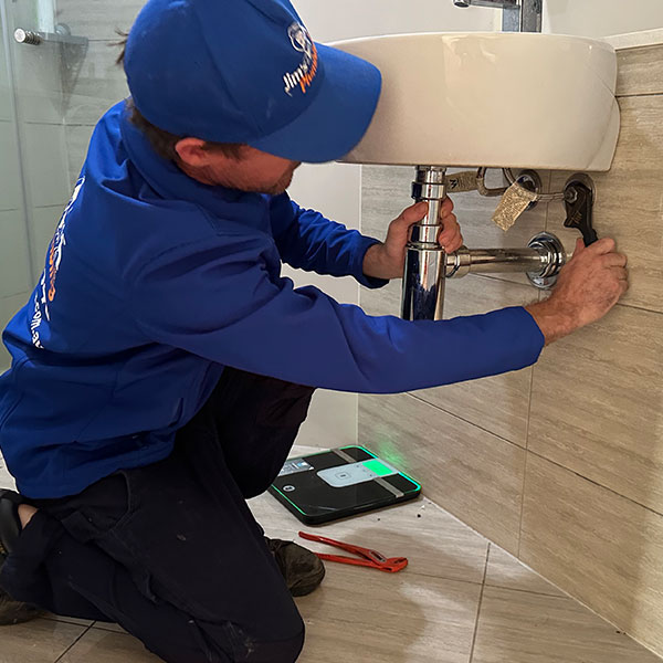 Rhys fixing leaking sink