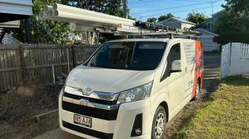 Rhys's van parked in home driveway with PVC pipes on roof