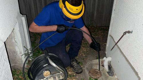 Rhys unblocking outdoor Brisbane drain using hydrojet